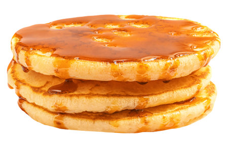 Stack of Fluffy pancakes isolated on white. Pancakes poured with honey caramel syrup. Package design elementの写真素材