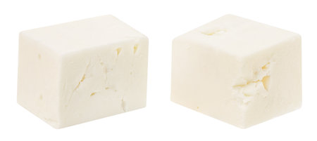 Feta cheese isolated. Greek fitaki cheese pieces on white background. Feta cubes Top view. Package design elementの写真素材