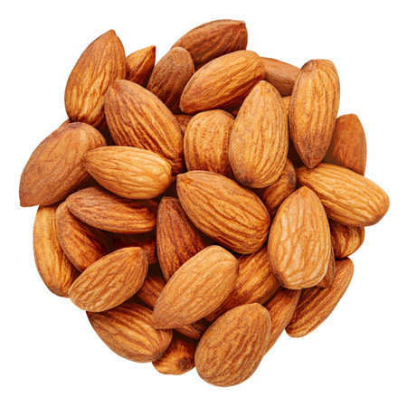 Almonds isolated on white background. Whole brown peeled almond nuts pile. Almonds Top view. Flat lay. Package design elementの写真素材
