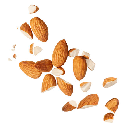 Peeled Almonds levitating in air on white background. Isolated Falling crushed almond nuts. Almonds explosion. Collection. Setの写真素材
