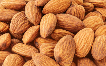 Almond nuts Background. Creative layout made of almond nuts. Texture. Flat lay. Food concept. Almonds patternの写真素材