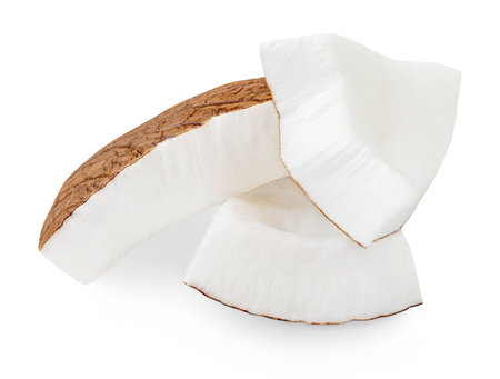 Coconut pieces isolated on white. Tropical coconut fruit slices close up. Coco nut Package design elementsの写真素材