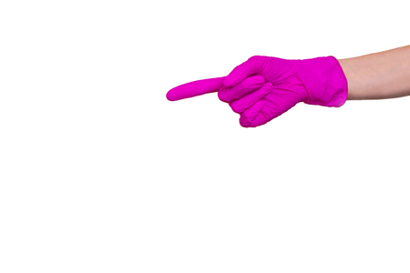 Female hand in purple medical glove showing way the index finger. One arm isolated on a white background.の写真素材