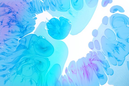 Abstract blue drops on the white background. View of macro world through the microscope.の写真素材
