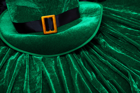 A St. Patrick's day costume hat of a leprechaun. Green Irish hat is on a green background.の写真素材