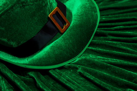 A St. Patrick's day costume hat of a leprechaun. Green Irish hat is on a green background.の写真素材