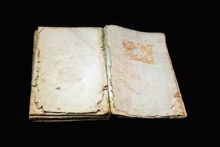Old book cover, vintage texture, isolated on black backgroundの写真素材