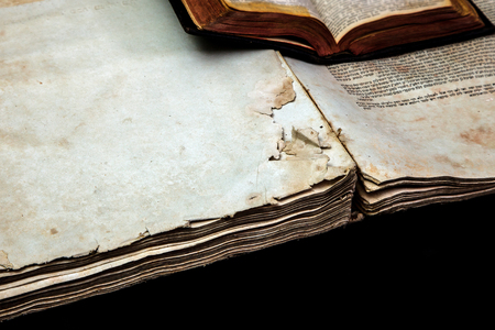 Old book cover, vintage texture, isolated on black background. Old Jewish Talmud in Yiddish with Bible.の写真素材