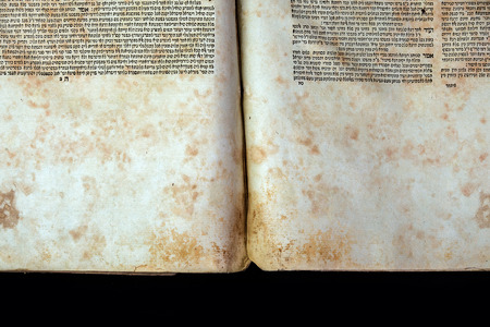 Old book cover, vintage texture, isolated on black background. Old Jewish Talmud in Yiddish.の写真素材