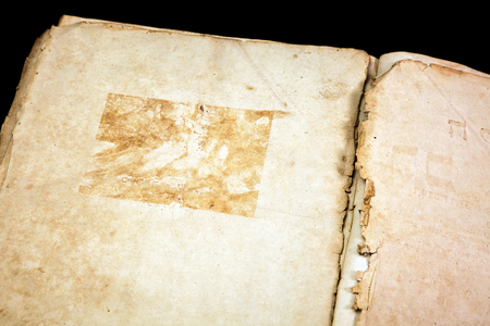 Old book cover, vintage texture, isolated on black backgroundの写真素材