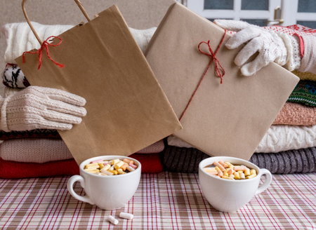 Two Hands holding packing Gifts on the eve of holiday New Year.の写真素材