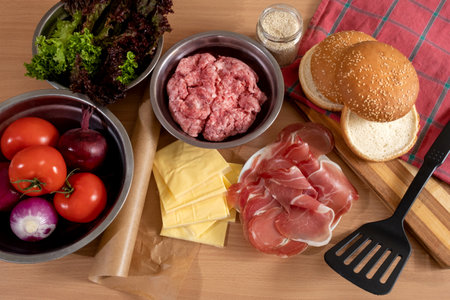 Products and ingredients for cooking Big Burger or Cheeseburger on the table, top view.の写真素材