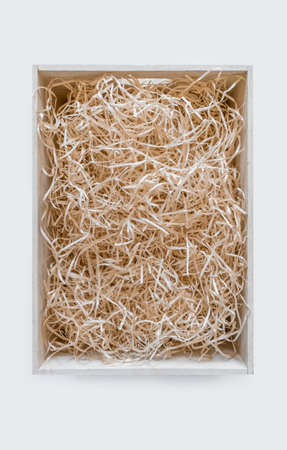 Straw into storage box for wine on the white background, delivery service.の写真素材