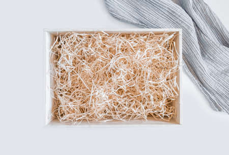 Straw into storage box for wine on the white background, delivery service.の写真素材