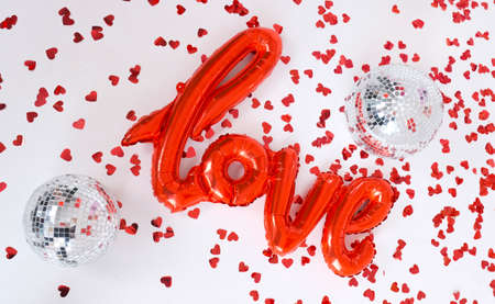 Red Letters Love for party Valentine's day and hearts on the white background, top view.の写真素材