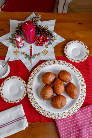 The typical Dutch food Olie Bollen, it is traditional Netherlands Donuts that Dutch people eating during Christmas and New Yearの写真素材