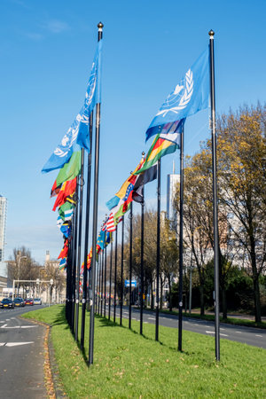 Alley or a street with many flags of different countries. Parade of flags near the World Forum in The Hague, Netherlands.の写真素材