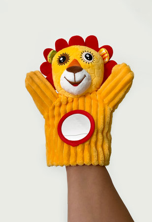 Bright yellow hand puppet animal interactive toy little lion cub for baby up to 1 yearの写真素材