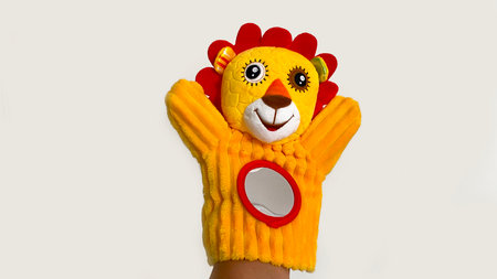 Bright yellow hand puppet animal interactive toy little lion cub for baby up to 1 yearの写真素材