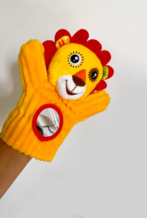 Bright yellow hand puppet animal interactive toy little lion cub for baby up to 1 yearの写真素材