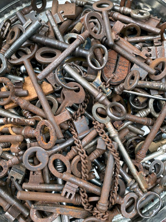 Many old copper iron keys covered with patina, old Dutch vintage keys, top viewの写真素材