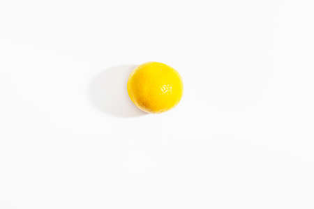 One whole tangerine on a white background. New Year and Christmas symbol. Isolate. Lifestyle....