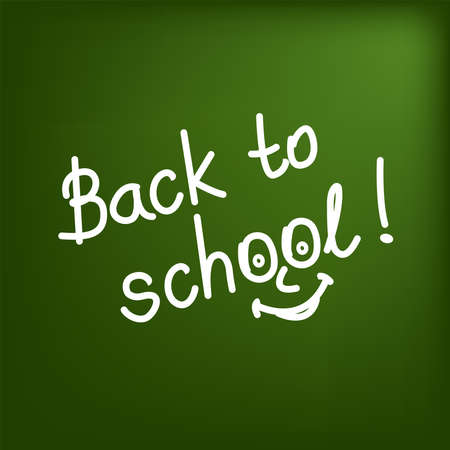 White text with a smile "Back to school" on the green background of the blackboardのイラスト素材