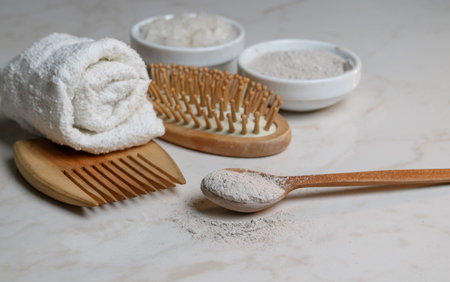 Wooden items for body care and hair on a marble background. Relaxation in the spa salon. Meditation and body care. pleasure items, bath salts, body clay. means for relaxation and recovery. organic products for the body. natural remedies.の写真素材