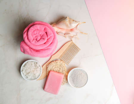 Wooden items for body care and hair on a marble background. Relaxation in the spa salon. Meditation and body care. pleasure items, bath salts, body clay. means for relaxation and recovery. organic products for the body. natural remedies.の写真素材