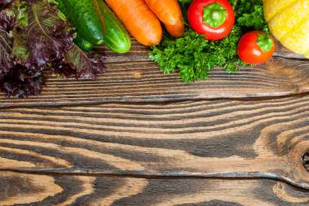 Various vegetables on a wooden table. Top view.の写真素材