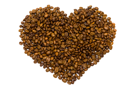 Coffee beans in heart shape white background. Top viewの写真素材