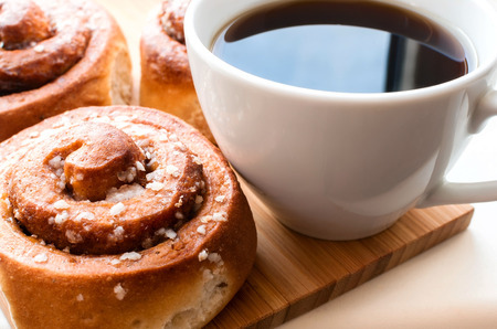 Cinnamon rolls with coffee. Selective focus.の写真素材