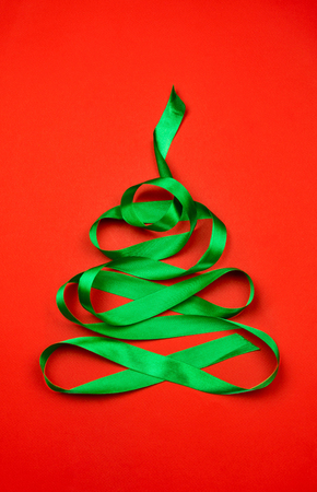 Christmas tree made of green ribbon. Flat lay, concept of Christmas time.の写真素材