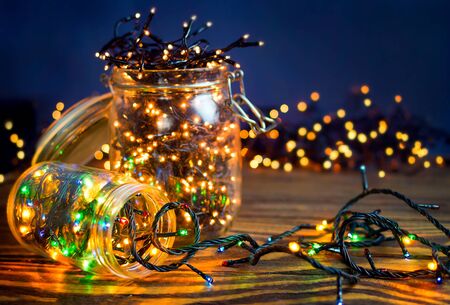 Christmas lights in a jars, concept of Christmas time, selective focus.の写真素材