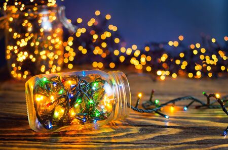 Christmas lights in a jars, concept of Christmas time, selective focus.の写真素材