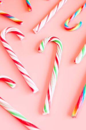 Candy canes on pink background. Selective focus.の写真素材