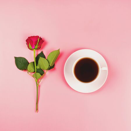 Romantic flat lay with a hot beverage and a red rose, top view, square image, good morning conceptの写真素材