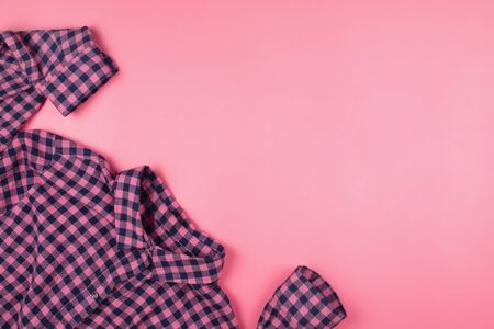 Pink checked shirt on pink background. Copyspaceの写真素材