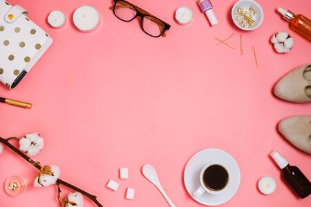Beautiful flatlay frame arrangement with cosmetics, planner, cup of espresso, glasses and other beauty or business accessories. Business or fashion feminine mockup, copyspaceの写真素材
