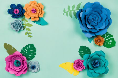 Beautiful floral spring or summer. Papercraft flowers on blue backgroundの写真素材