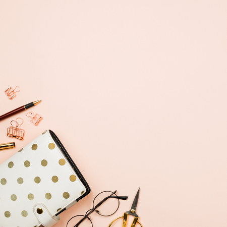Various stationary accessories on pastel background: glasses, clips, planner, scissors, flatlayの写真素材
