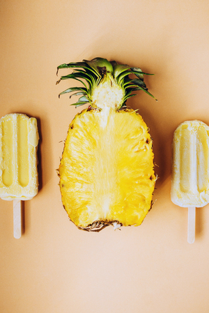 Flatlay with cup pineapple and two fruit ice creamの写真素材