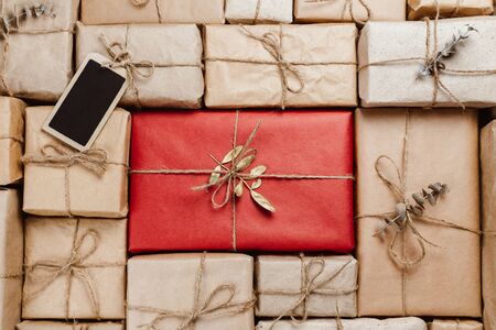 Various gift boxes wrapped in eco-friendly craft paper with stringsの写真素材