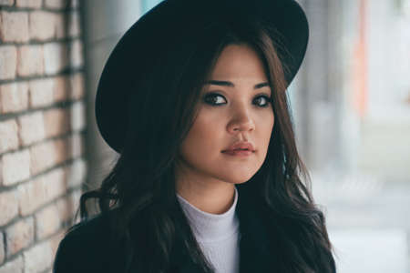 Closeup portrait of beautiful young asian female outdoorsの写真素材