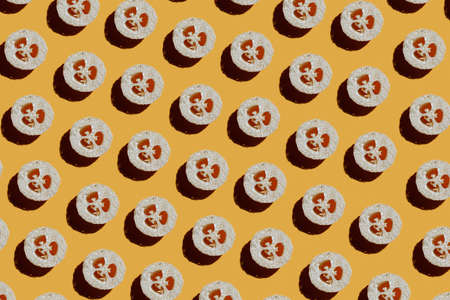 Pattern of loofah sponges on yellowの写真素材