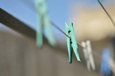 Urban pegs on a  clothesline selective focus