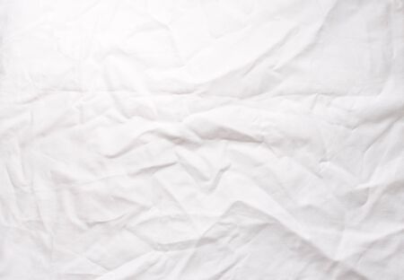 Full frame view of crumpled white cotton tableclothの写真素材