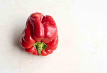 High angle view of red capsicum on limestone background with copy space to right (selective focus)の写真素材