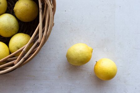 High angle view of limes on cream limestone background (selective focus)の写真素材