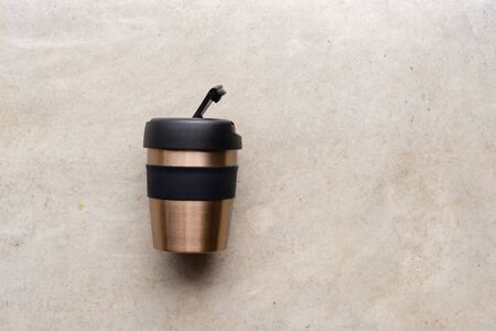 High angle view of reusable coffee cup on concrete backgroundの写真素材